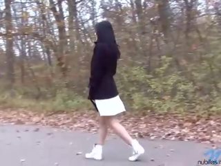 Terrific dark haired teen with huge tits pissing outdoor
