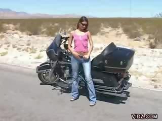 Dark haired chick Babes Harley Davidson bike