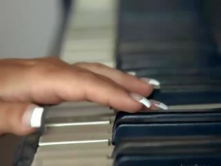 Busty blondie toying snatch on the piano