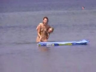 Two inviting teens naked at beach