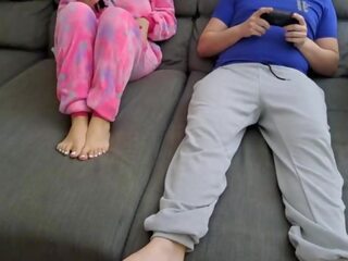 Stepsister sucks stepbrother and eats his sperm while he plays vid games